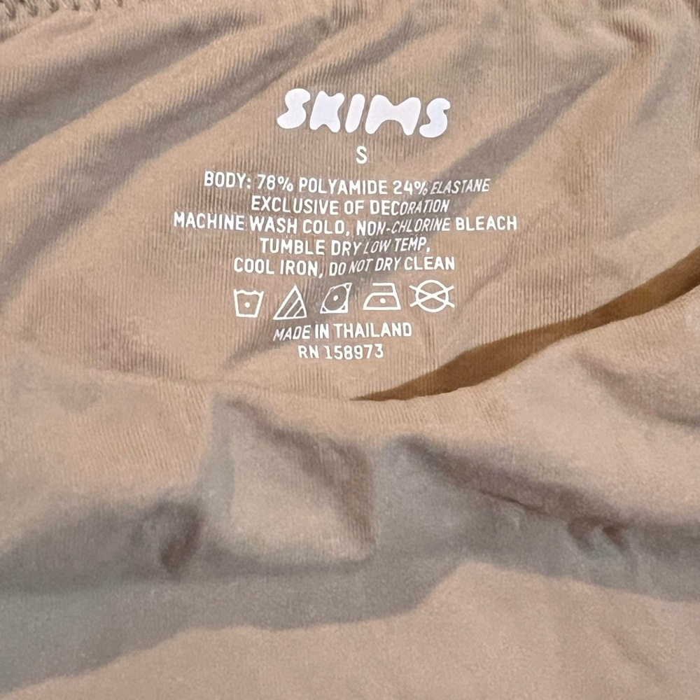 Skims nude body suit with tag